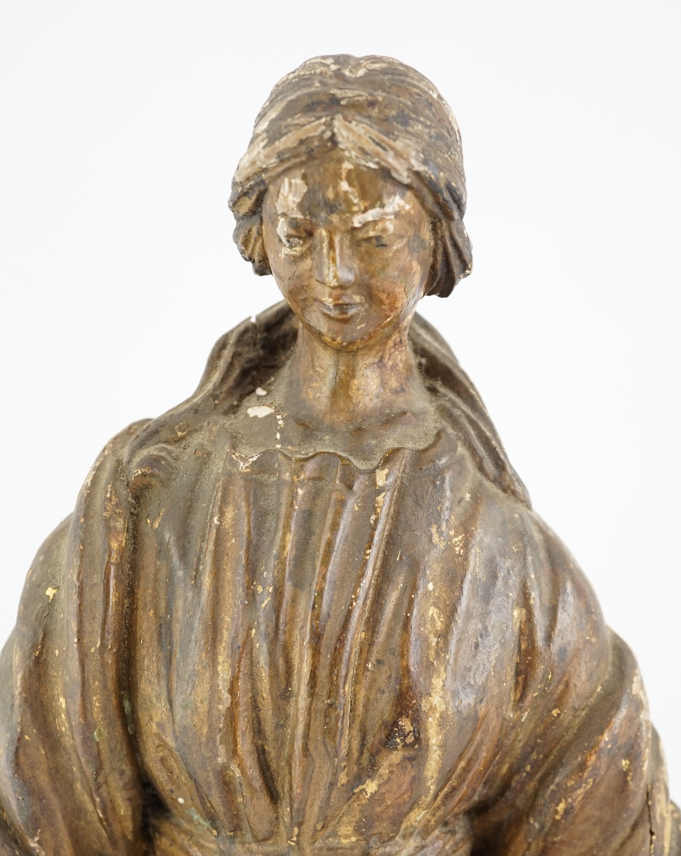 An 18th century Continental carved wood figure of a female saint